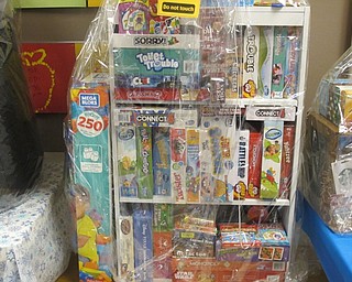 Neighbors | Zack Shively.Some of the prize baskets at Union Elementary's Holiday Shoppe will include toys and games for children and the family, such as the board game basket pictured, whil other prizes are aimed more for adults, such as a Poland Bulldog chopping board.