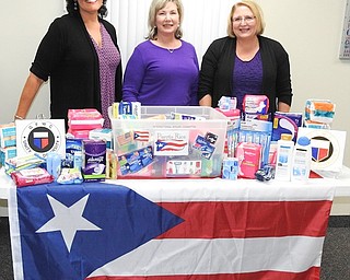 The Austintown Junior Women’s League collected women’s products at its October meeting to be donated for the hurricane relief effort in Puerto Rico. This international affairs project, in cooperation with the Outreach Center on Raccoon Road, will be delivered to Puerto Rico by the National Guard. The center also has collected other materials and supplies for the hurricane-ravaged country. Information about AJWL can be found at www.austintownjuniorwomensleague.org or on Facebook at AJWL2014. Above, are some AJWC members who participated in the effort, from left, Ruty Rodriguez-Patterson, Linda Jones, first vice president, and Colleen Miller, international affairs chairwoman.