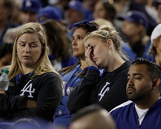 Fans watch during the eighth inning of Game 7 of baseball's World Series between the Houston Astros and the Los Angeles Dodgers Wednesday, Nov. 1, 2017, in Los Angeles. (AP Photo/Matt Slocum)