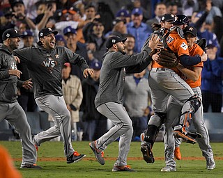 Members the the Houston Astros celebrate their win against the Los Angeles Dodgers in Game 7 of baseball's World Series Wednesday, Nov. 1, 2017, in Los Angeles. (AP Photo/Mark J. Terrill)