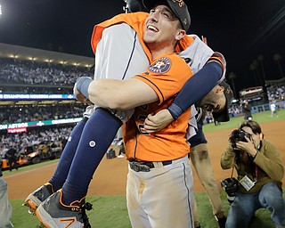 Houston Astros' Jose Altuve and Alex Bregman celebrate after Game 7 of baseball's World Series against the Los Angeles Dodgers Wednesday, Nov. 1, 2017, in Los Angeles. The Astros won 5-1 to win the series 4-3. (AP Photo/David J. Phillip)