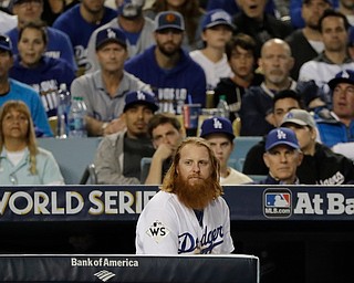 Los Angeles Dodgers' Justin Turner watches during the eighth inning of Game 7 of baseball's World Series against the Houston Astros Wednesday, Nov. 1, 2017, in Los Angeles. (AP Photo/David J. Phillip)