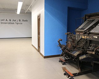     ROBERT K. YOSAY  | THE VINDICATOR..The original Vindicator building on the corner of Vindicator Square and Boardman St  has been renovated and opens for YBI...The first  floor formerly business and circulation now called innovation place- with two liinotype machines in an alcove ..-30-