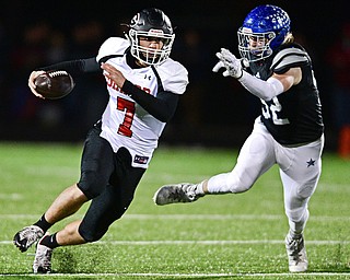 CORTLAND, OHIO - NOVEMBER 3, 2017: Girard's Mark Waid, left, runs the ball away from Lakeview's Alec Bartholomew during the first half of the OHSAA playoff game, Friday night at Lakeview High School. DAVID DERMER | THE VINDICATOR