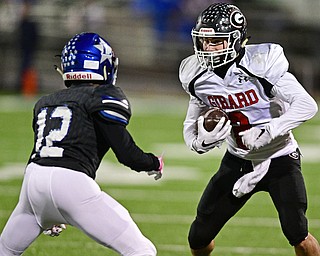 CORTLAND, OHIO - NOVEMBER 3, 2017: Girard's Michael Belcik, right, runs before being hit by Lakeview's Michael Hill during the first half of the OHSAA playoff game, Friday night at Lakeview High School. DAVID DERMER | THE VINDICATOR
