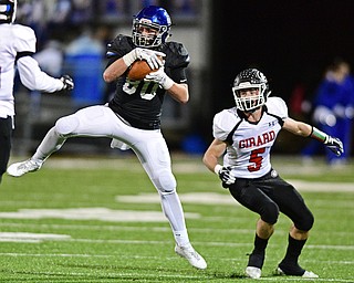 CORTLAND, OHIO - NOVEMBER 3, 2017: Lakeview's Drew Munno, left, secures the ball before being hit by Girard's Nicholas Malito during the first half of the OHSAA playoff game, Friday night at Lakeview High School. DAVID DERMER | THE VINDICATOR