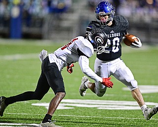 CORTLAND, OHIO - NOVEMBER 3, 2017: Lakeview's Tony Crish, right, runs the ball before being hit by Girard's Terrance Davis during the second half of the OHSAA playoff game, Friday night at Lakeview High School. DAVID DERMER | THE VINDICATOR