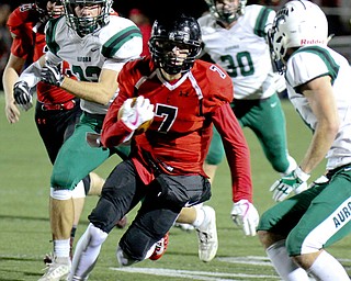 William D Lewis The Vindicator Canfield's Matt Zaremski(7) eludes a host of Aurora defenders during 11-3-17 playoff action with Aurora at Canfield.