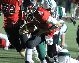 William D Lewis The Vindicator  Canfield's Vinny Fiorenza(2) eludes Aurora's John Papesh(4)   during 11-3-17 playoff action with Aurora at Canfield.