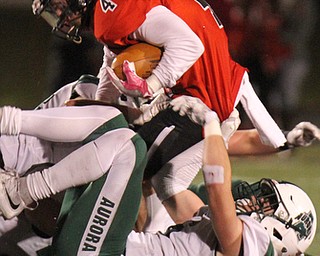 William D Lewis The Vindicator  Canfield's Paul Breinz(4) scampers over aurora's Gavin Blunt(6)  during 11-3-17 playoff action with Aurora at Canfield.