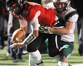 William D Lewis The Vindicator Canfield's Vinny Fiorenza(2) is stopped by Aurora'sJared DiMicco(14)during 11-3-17 playoff action with Aurora at Canfield.