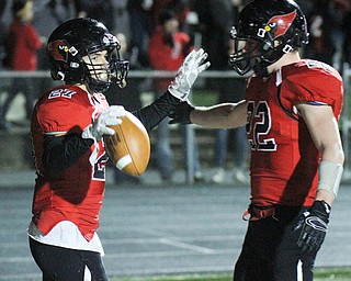 William D Lewis The Vindicator Canfield's Paul French(27) gets congrats from Jacob Whittenberge(32) after scoring during 2nd qtr 11-3-17 playoff action with Aurora at Canfield.
