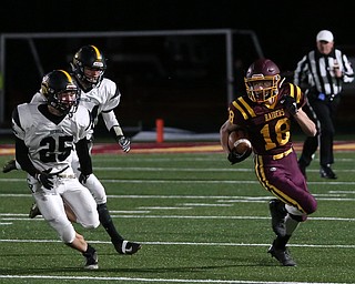 South Range's Mathias Combs(18) runs the ball as he looks at Crestview's Danny Moore(25) on the kickoff during the first quarter as Crestview High School takes on South Range High School, Friday, Nov. 3, 2017, at Raider's stadium at the Rominger Sports Complex in Canfield...(Nikos Frazier | The Vindicator)..