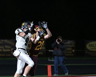 Crestview's Dylan Huff(9) and South Range's Josh Stear(20) go up for a pass intended for Huff in the endzone during the first quarter as Crestview High School takes on South Range High School, Friday, Nov. 3, 2017, at Raider's stadium at the Rominger Sports Complex in Canfield...(Nikos Frazier | The Vindicator)..