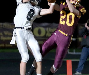 Crestview's Dylan Huff(9) and South Range's Josh Stear(20) go up for a pass intended for Huff in the endzone during the first quarter as Crestview High School takes on South Range High School, Friday, Nov. 3, 2017, at Raider's stadium at the Rominger Sports Complex in Canfield...(Nikos Frazier | The Vindicator)..
