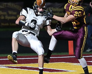 Crestview's Dylan Huff(9) and South Range's Josh Stear(20) go up for a pass intended for Huff in the endzone during the first quarter as Crestview High School takes on South Range High School, Friday, Nov. 3, 2017, at Raider's stadium at the Rominger Sports Complex in Canfield...(Nikos Frazier | The Vindicator)..