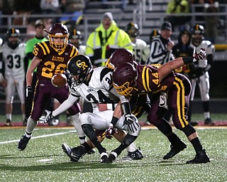 Crestview's Jeff Feo(24) fumbles the ball as the South Range defense tackles him from behind during the first quarter as Crestview High School takes on South Range High School, Friday, Nov. 3, 2017, at Raider's stadium at the Rominger Sports Complex in Canfield. South Range's Peyton Remish(44)...(Nikos Frazier | The Vindicator)..