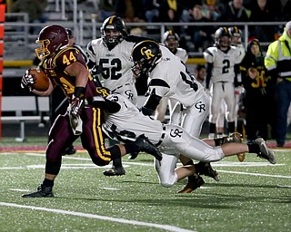 South Range's Peyton Remish(44) runs the ball as Crestview's Banny Moore(25) attempts to bring him down during the first quarter as Crestview High School takes on South Range High School, Friday, Nov. 3, 2017, at Raider's stadium at the Rominger Sports Complex in Canfield...(Nikos Frazier | The Vindicator)..