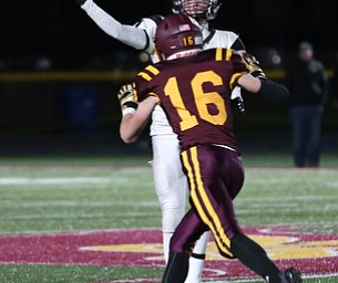 Crestview quarterback Caleb Hill(11) throws as South Range's Alec Ballentine(16) draws in for the tackle during the second quarter as Crestview High School takes on South Range High School, Friday, Nov. 3, 2017, at Raider's stadium at the Rominger Sports Complex in Canfield...(Nikos Frazier | The Vindicator)..
