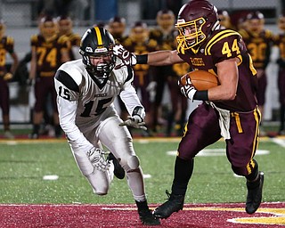 South Range's Peyton Remish(44) stiff arms Crestview's Stephen Barr(15) during the second quarter as Crestview High School takes on South Range High School, Friday, Nov. 3, 2017, at Raider's stadium at the Rominger Sports Complex in Canfield...(Nikos Frazier | The Vindicator)..