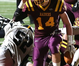 South Range quarterback Aniello Buzzacco(14) makes the sign of the cross and points upwards after scoring a touchdown during the second quarter as Crestview High School takes on South Range High School, Friday, Nov. 3, 2017, at Raider's stadium at the Rominger Sports Complex in Canfield...(Nikos Frazier | The Vindicator)..