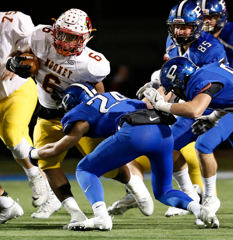 POLAND, OHIO - NOVEMBER 3, 2017:   Mooney's Andre McCoy (6) is tackled by Poland's Tarren Amill (24) during the1st qtr. at Poland Stadium. MICHAEL G TAYLOR | THE VINDICATOR