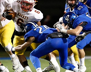 POLAND, OHIO - NOVEMBER 3, 2017: Mooney's Andre McCoy (6) is tackled by Poland's Tarren Amill (24) during the1st qtr. at Poland Stadium. MICHAEL G TAYLOR | THE VINDICATOR