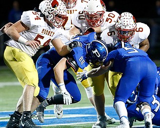 POLAND, OHIO - NOVEMBER 3, 2017: Mooney's Andre McCoy (6) is tackled by Poland's Eric Shipsky (5) and Mike Voitus (88) during the1st qtr. at Bulldog Stadium. MICHAEL G TAYLOR | THE VINDICATOR