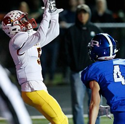 POLAND, OHIO - NOVEMBER 3, 2017:   Mooney's Nico Marchionda (5) catches a TD pass as Poland's Mike Diaz (4) defends during the 2nd qtr. at Bulldog Stadium. MICHAEL G TAYLOR | THE VINDICATOR