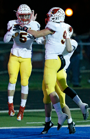 POLAND, OHIO - NOVEMBER 3, 2017:   Mooney's Nico Marchionda (5) celebrates his TD catch with his teammates during the 2nd qtr. at Bulldog Stadium. MICHAEL G TAYLOR | THE VINDICATOR
