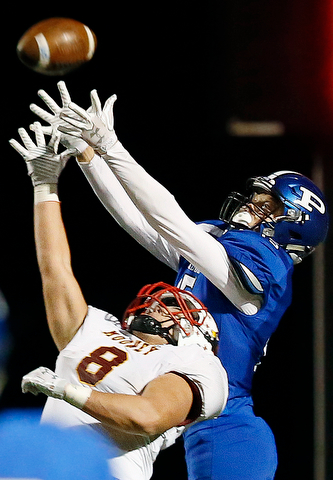 POLAND, OHIO - NOVEMBER 3, 2017:   Poland's Nate Alessi (15) tries to make a desparate, last play 4th down pass but it is knocked away by Mooney's Brennan Olesh (8) during the 4th qtr. at Bulldog Stadium. MICHAEL G TAYLOR | THE VINDICATOR