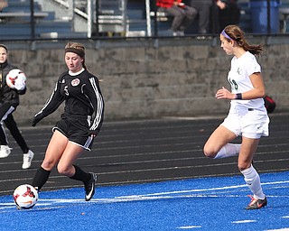 Canfield forward Marisa Scheetz (5) charges towards the goal as Lake Catholic defender Julia Marusic (18) chases on during the first half as Lake Catholic High School takes on Canfield High School in the Division II Regional Final, Saturday, Nov. 4, 2017, at Gilcrest Field at Portage Community Bank Stadium in Ravenna, Ohio. Lake won 2-0...(Nikos Frazier | The Vindicator)..