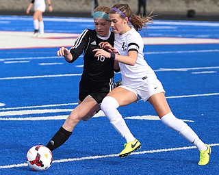 Canfield defender Ellie Accordino (16) and Lake Catholic midfielder Kennedy Newhart (5) fight for the ball during the first half as Lake Catholic High School takes on Canfield High School in the Division II Regional Final, Saturday, Nov. 4, 2017, at Gilcrest Field at Portage Community Bank Stadium in Ravenna, Ohio. Lake won 2-0...(Nikos Frazier | The Vindicator)..