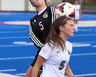Canfield forward Marisa Scheetz (5) and Lake Catholic midfielder Kennedy Newhart (5) go up for the ball during the first half as Lake Catholic High School takes on Canfield High School in the Division II Regional Final, Saturday, Nov. 4, 2017, at Gilcrest Field at Portage Community Bank Stadium in Ravenna, Ohio. Lake won 2-0...(Nikos Frazier | The Vindicator)..