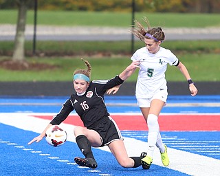 Canfield defender Ellie Accordino (16) is pushed down by Lake Catholic midfielder Kennedy Newhart (5) during the first half as Lake Catholic High School takes on Canfield High School in the Division II Regional Final, Saturday, Nov. 4, 2017, at Gilcrest Field at Portage Community Bank Stadium in Ravenna, Ohio. Lake won 2-0...(Nikos Frazier | The Vindicator)..
