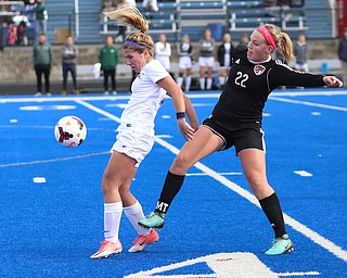 Lake Catholic midfielder Ali Morgan (7) and Canfield midfielder Chloe Kalina (22) fight for the ball during the first half as Lake Catholic High School takes on Canfield High School in the Division II Regional Final, Saturday, Nov. 4, 2017, at Gilcrest Field at Portage Community Bank Stadium in Ravenna, Ohio. Lake won 2-0...(Nikos Frazier | The Vindicator)..