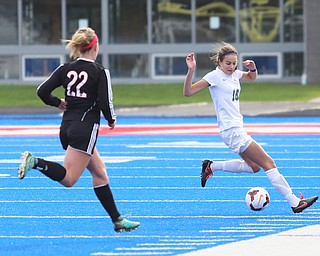 Lake Catholic defender Julia Marusic (18) reaches out for the ball as Canfield midfielder Chloe Kalina (22) nears during the first half as Lake Catholic High School takes on Canfield High School in the Division II Regional Final, Saturday, Nov. 4, 2017, at Gilcrest Field at Portage Community Bank Stadium in Ravenna, Ohio. Lake won 2-0...(Nikos Frazier | The Vindicator)..