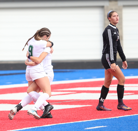 Lake Catholic forward Keka Babic (9) is congratulated by her teammates after scoring a goal during the first half as Lake Catholic High School takes on Canfield High School in the Division II Regional Final, Saturday, Nov. 4, 2017, at Gilcrest Field at Portage Community Bank Stadium in Ravenna, Ohio. Lake won 2-0...(Nikos Frazier | The Vindicator)..