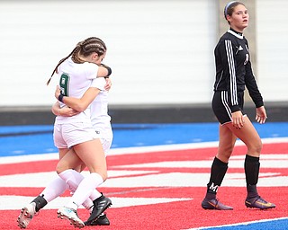 Lake Catholic forward Keka Babic (9) is congratulated by her teammates after scoring a goal during the first half as Lake Catholic High School takes on Canfield High School in the Division II Regional Final, Saturday, Nov. 4, 2017, at Gilcrest Field at Portage Community Bank Stadium in Ravenna, Ohio. Lake won 2-0...(Nikos Frazier | The Vindicator)..