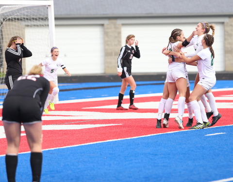 Lake Catholic forward Keka Babic (9) is congratulated by her teammates after scoring a goal during the first half as Lake Catholic High School takes on Canfield High School in the Division II Regional Final, Saturday, Nov. 4, 2017, at Gilcrest Field at Portage Community Bank Stadium in Ravenna, Ohio. Lake won 2-0...(Nikos Frazier | The Vindicator)..