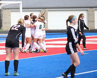 Lake Catholic forward Keka Babic (9) is congratulated by her teammates after scoring a goal during the first half as Lake Catholic High School takes on Canfield High School in the Division II Regional Final, Saturday, Nov. 4, 2017, at Gilcrest Field at Portage Community Bank Stadium in Ravenna, Ohio. Lake won 2-0...(Nikos Frazier | The Vindicator)..