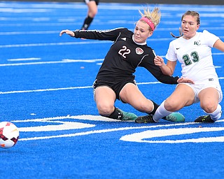 Canfield midfielder Chloe Kalina (22) and Lake Catholic forward Andrea Babic (23) fall down after fighting for the ball during the first half as Lake Catholic High School takes on Canfield High School in the Division II Regional Final, Saturday, Nov. 4, 2017, at Gilcrest Field at Portage Community Bank Stadium in Ravenna, Ohio. Lake won 2-0...(Nikos Frazier | The Vindicator)..