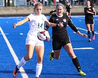 Lake Catholic forward Grace Mohr (14) waits before kicking the ball away from Canfield do Hannah Stein (25) during the second half as Lake Catholic High School takes on Canfield High School in the Division II Regional Final, Saturday, Nov. 4, 2017, at Gilcrest Field at Portage Community Bank Stadium in Ravenna, Ohio. Lake won 2-0...(Nikos Frazier | The Vindicator)..