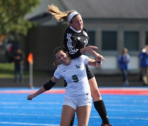 Canfield defender Ally Stein (24) jumps above Lake Catholic forward Keka Babic (9) to head the ball during the second half as Lake Catholic High School takes on Canfield High School in the Division II Regional Final, Saturday, Nov. 4, 2017, at Gilcrest Field at Portage Community Bank Stadium in Ravenna, Ohio. Lake won 2-0...(Nikos Frazier | The Vindicator)..