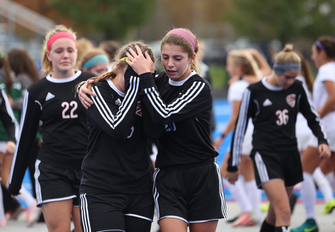 Canfield midfielder Mirabella Mangie (8)(left) is comforted by Canfield defender Camryn Kohout (20) after Lake Catholic High School defeated Canfield High School in the Division II Regional Final, Saturday, Nov. 4, 2017, at Gilcrest Field at Portage Community Bank Stadium in Ravenna, Ohio...(Nikos Frazier | The Vindicator)..