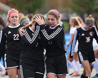 Canfield midfielder Mirabella Mangie (8)(left) is comforted by Canfield defender Camryn Kohout (20) after Lake Catholic High School defeated Canfield High School in the Division II Regional Final, Saturday, Nov. 4, 2017, at Gilcrest Field at Portage Community Bank Stadium in Ravenna, Ohio...(Nikos Frazier | The Vindicator)..
