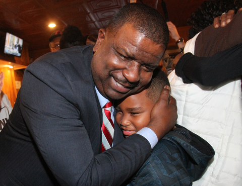 William D Lewis The Vindicator Tito Brown is all smiles as he hugs his son Quentin, 7, during victory party at MVR 11-7-2-17.