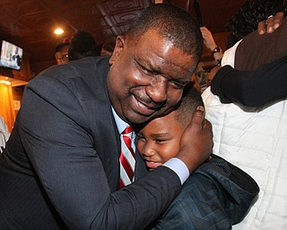 William D Lewis The Vindicator Tito Brown is all smiles as he hugs his son Quentin, 7, during victory party at MVR 11-7-2-17.