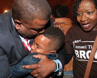 William D Lewis The Vindicator Tito Brown is all smiles as he hugs his son Quentin, 7, during victory party at MVR 11-7-2-17.