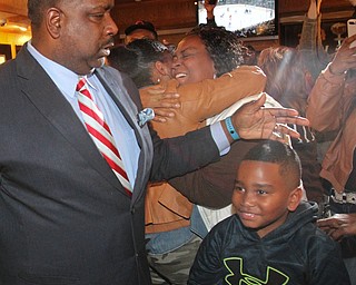 William D Lewis The Vindicator Tito Brown is all smiles as he hugs his son Quentin, 7, during victory party at MVR 11-7-2-17.
